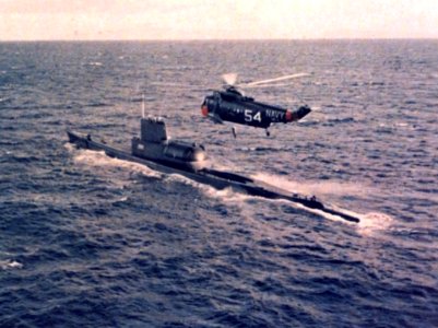 SH-3A Sea King of HS-4 flies over USS Tunny (SSG-282) c1964