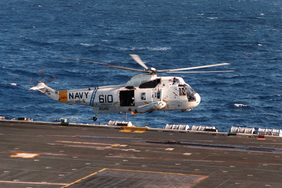 SH-3H HS-5 over hovers over USS Eisenhower (CVN-69) 1984