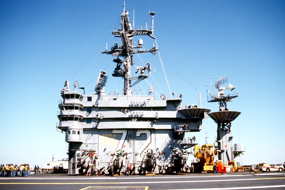 SH-3Hs of HS-17 parked next to the island of USS Abraham Lincoln (CVN-72) in 1990