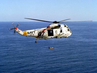 SH-3H of HS-10 in flight with lowered MAD sensor 1984