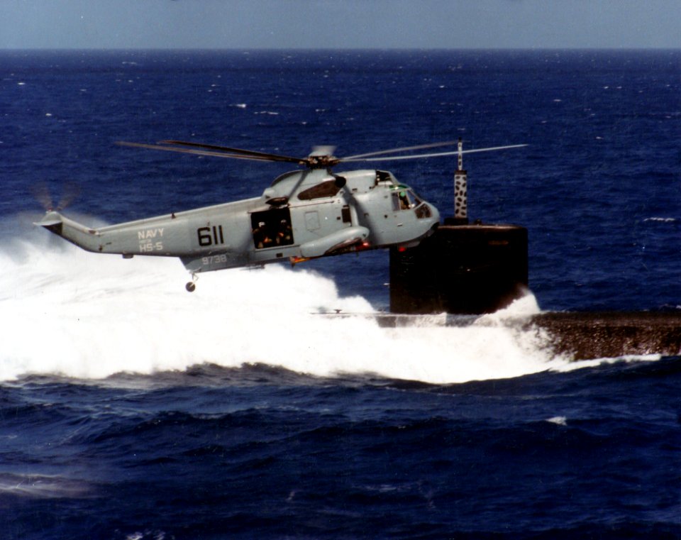 SH-3H Sea King of HS-5 in flight over a Los Angeles-class submarine, circa 1985 (NNAM.2011.113.393)