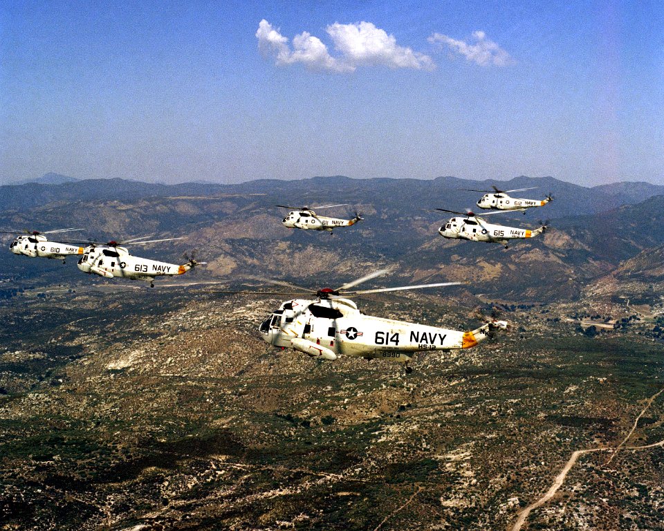 SH-3H Sea Kings of HS-12 in flight 1983