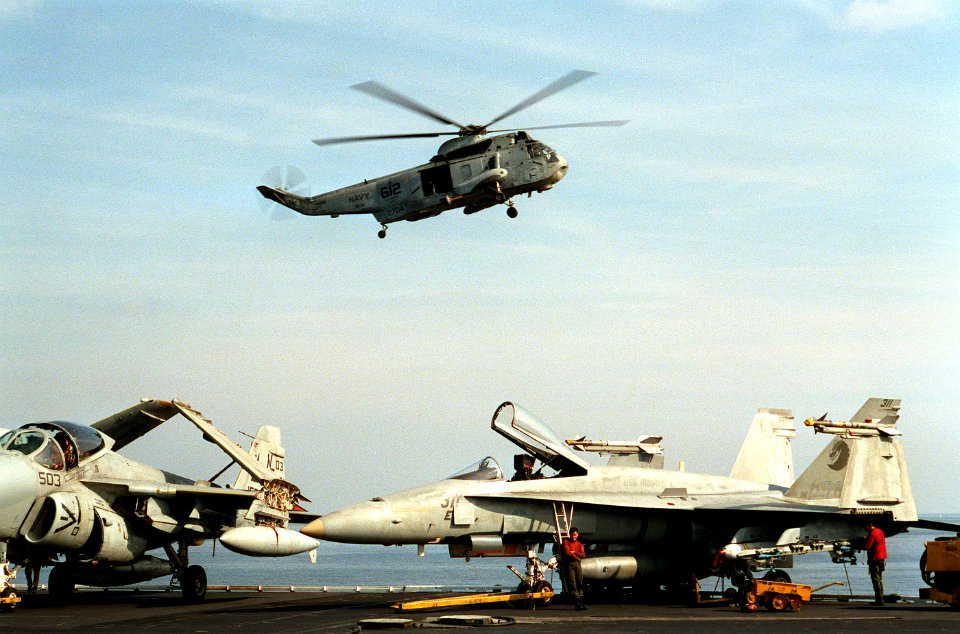SH-3H of HS-12 near USS Midway (CV-41) in 1991
