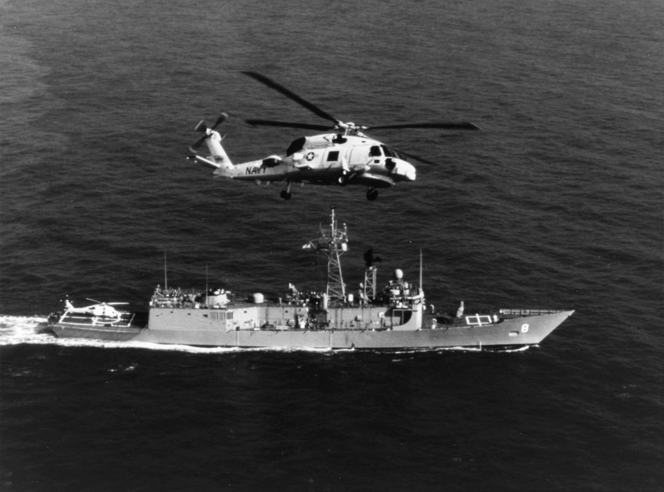 SH-60B Seahawk in flight over USS McInerney (FFG-8) in March 1981