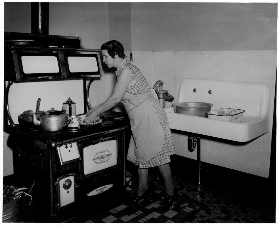 Shelby County, Iowa. Kitchen and living room in the dwelling of a medium-sized owner-operated farm. . . . - NARA - 522369
