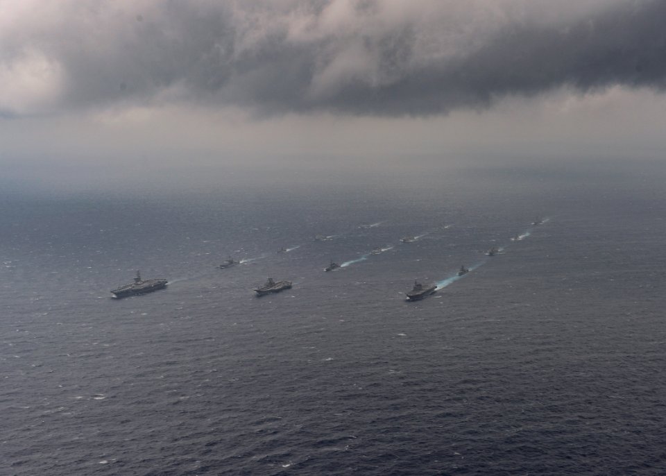 Ships from the Indian Navy, Japan Maritime Self-Defense Force (JMSDF) and the United States Navy sail in formation in the Bay of Bengal during exercise Malabar 2017