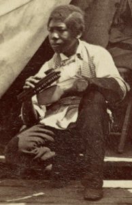 Shoe shine by African American child detail, from- 7th N.Y. State Militia, Camp Cameron, D.C., 1861 LCCN2013648449 (cropped)