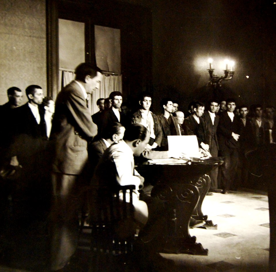 Sicilian civilians being tried in a court for rioting, 1943 (24479530531)