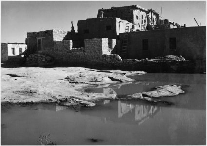Side view of adobe house with water in foreground, Acoma Pueblo (National Historic Landmark, New Mexico)., 1933 - 1942 - NARA - 519834