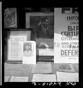 Signs in the windows of a Marcus Garvey club in the Harlem area 8d28531v