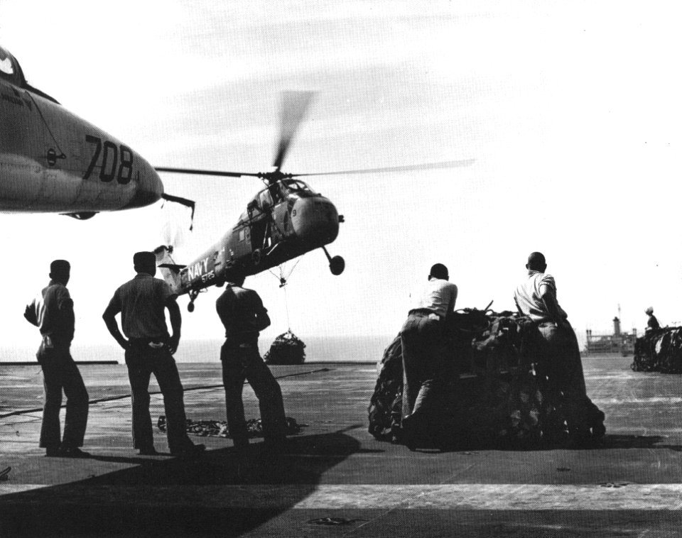 Sikorsky UH-34D of HU-4 delivers cargo to USS Enterprise (CVAN-65), in 1964