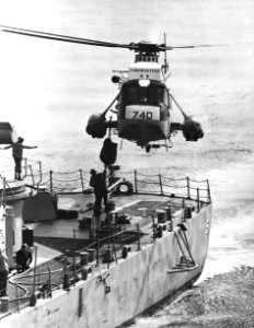 Sikorsky SH-3G Sea King delivers mail to USS Claude V. Ricketts (DDG-5), circa in 1979