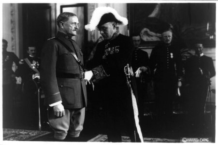 Sir Aukland Campbell Geddes presenting award to General John Pershing, in front of other men, all in dress uniform LCCN93511295
