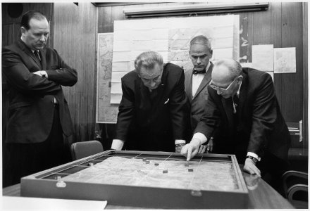 Situation Room, Walt Rostow shows President Lyndon B. Johnson a model of the Khe Sanh area - NARA - 192584