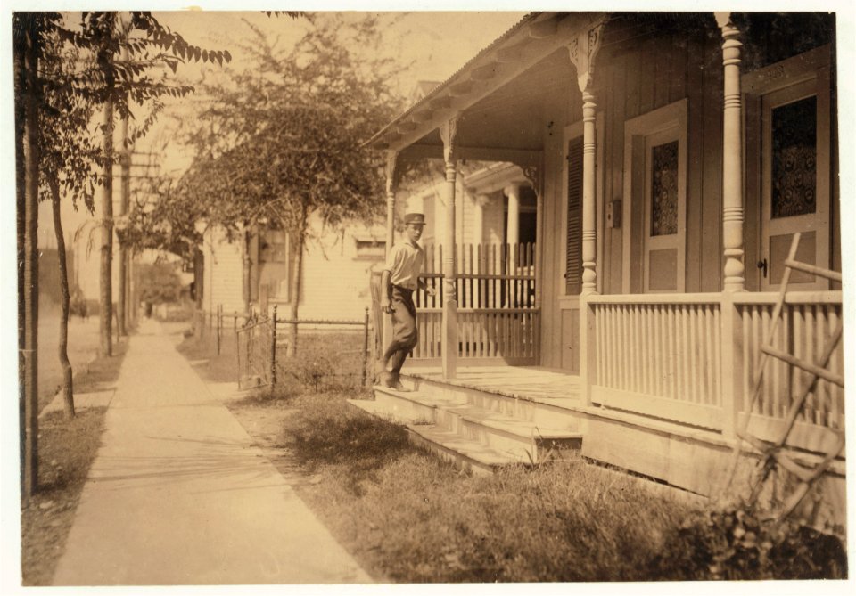 Sixteen year old messenger boy entering 'crib' in Red Light district. LOC cph.3c21887 photo