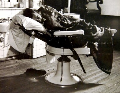 Sleeping in a barber chair. Rented for $1.50 a night, May 1942 (34211707214)