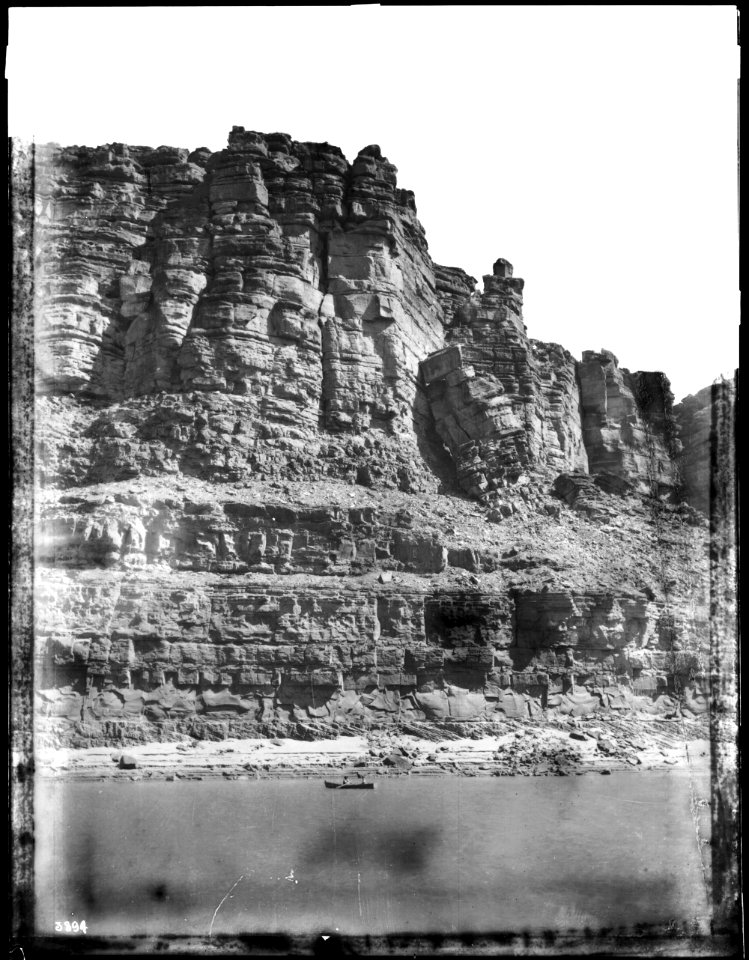 Small boat crossing the Colorado River in Marble Canyon, Grand Canyon, 1900-1930 (CHS-3894)