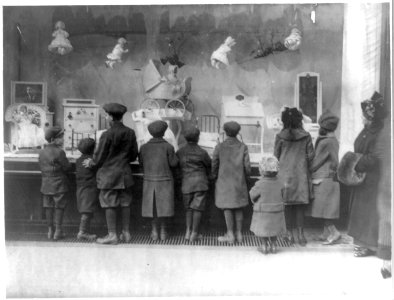 Small children gazing at Macy's Christmas window display, New York City. LCCN2017658563