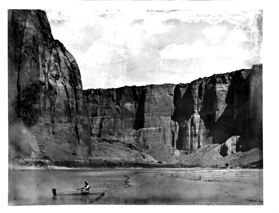 Small boat crossing the Colorado River at Lee's Ferry in Marble Canyon, Grand Canyon, 1900-1930 (CHS-3897)