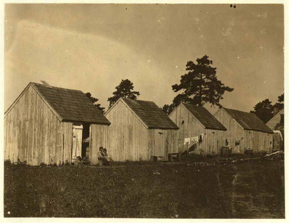 Small shack on Forsythe's Bog, occupied by De Marco family, 10 in the family living in this one room. Room is 10 ft. x 11 ft. x 5 1-2 ft. high and gable attic above. Wooden toilets near at LOC nclc.05310
