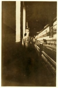 Small boy working in the Amoskeag Mfg. Company, Manchester N.H. Said he has been there several months. Photo at Noon, May 25, 1909. LOC nclc.01780