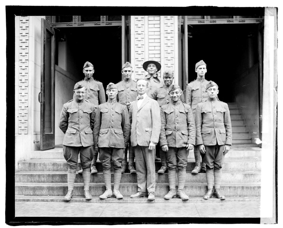 Small group of overseas soldiers who applied for Naturalization, June 6, 1919. Man in center is Raymond Christ, Director of Citizenship, Bureau of Naturalization, Department of Labor LCCN2016827097