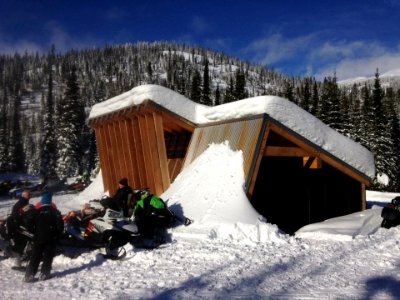 Snowmobiles outside a warming hut (39609485705)