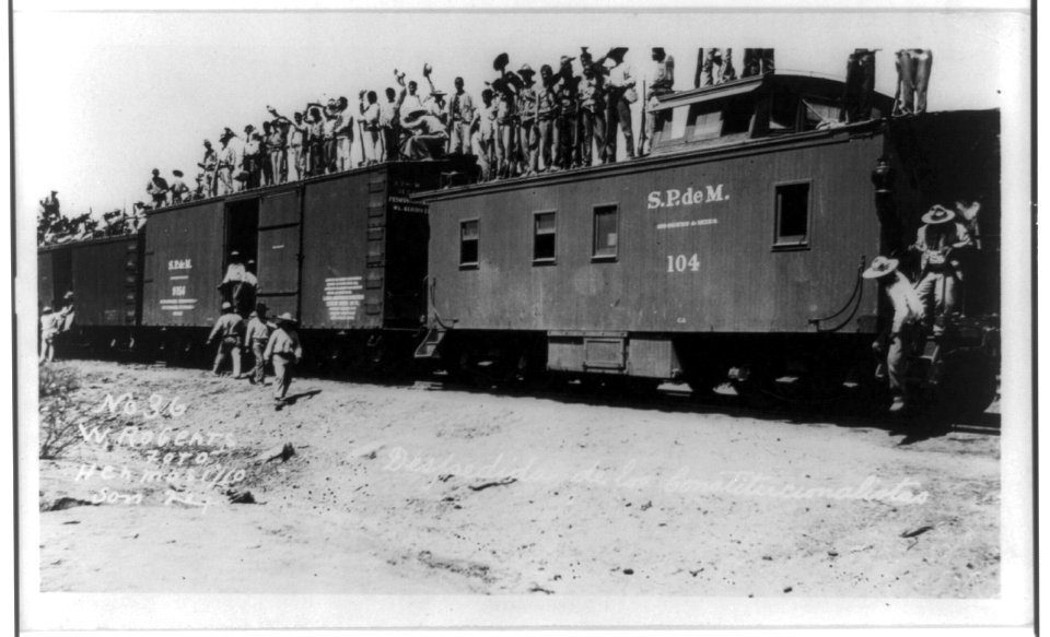 Soldiers standing on top of railroad cars, of S.P.deM. train, during the Mexican revolution LCCN93515622