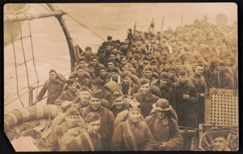 Soldiers returning home from war aboard ship, including one wearing a pickelhaube LCCN2018645949