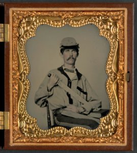 Soldier in Confederate uniform and Co. D, 3rd North Carolina Volunteers Regiment hat with short sword and sheath with initials J.L.W., probably for Private John L. Wood of Co. D, 3rd North LCCN2014645458