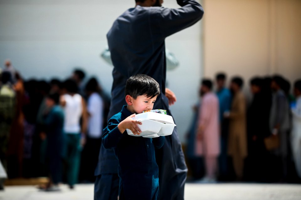 Soldiers assist with the evacuation at Hamid Karzai International Airport 210821-D-D0477-006