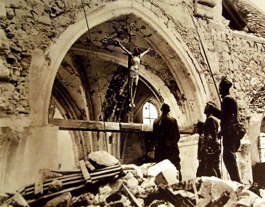 Soldiers looking at Christ on the cross at the Church at Lucy, France, WWI (28364511510)