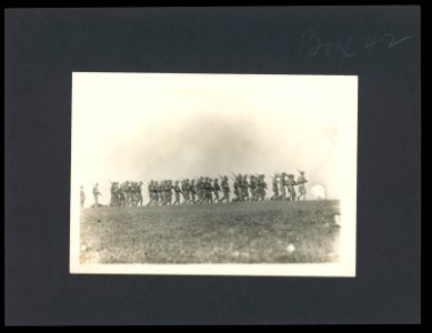 Soldiers marching with rifles in a field, probably a U.S. Army training exercise in the United States LCCN2016645659