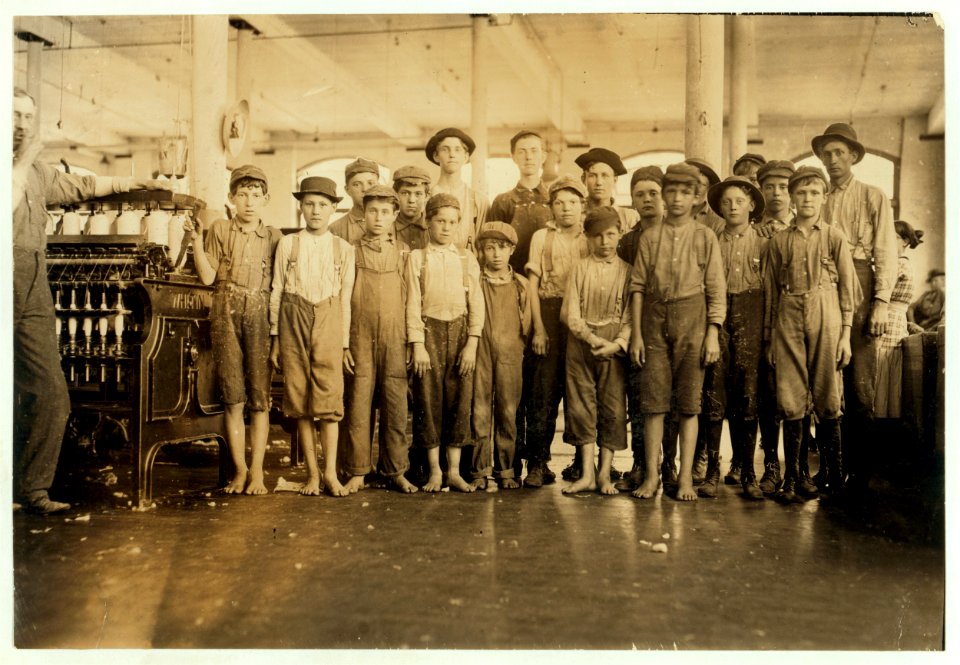 Some of the doffers in the Washington Cotton Mills, Fries, Va. The smallest one said he was 15 years old but, for that matter, they are all 'wise' to the necessity for being at least 14. All LOC cph.3a15219