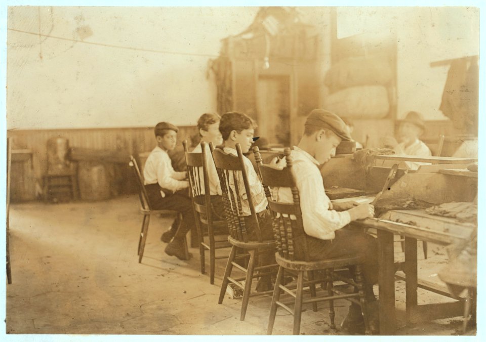 Some of the boys in a 'School Factory' De Pedro Casellas Cigar Factory, Tampa, Fla. 18 employees, 5 of them young apprentices. Pay to be permitted to work. LOC nclc.04510