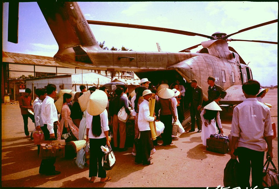 South Vietnamese villagers board an Air Force CH-3C helicopter for evacuation to another village as U.S. forces... - NARA - 542336