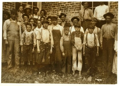 Some of the workers in Munford Cotton Mills. Smallest boy, in middle, a frail anaemic youngster, said he had been doffing over a year. Said he was twelve, but I doubt it. Other small boy, on LOC nclc.01929 photo