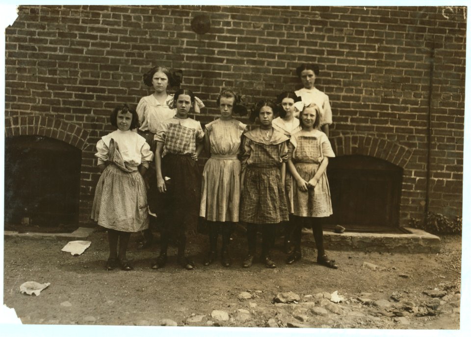 Some of the young girls who roll cigarettes in the Danville (Va.) Cigarette Factory. I could not induce the very smallest ones to get into the photos. See other photos taken at noon and in LOC nclc.04749