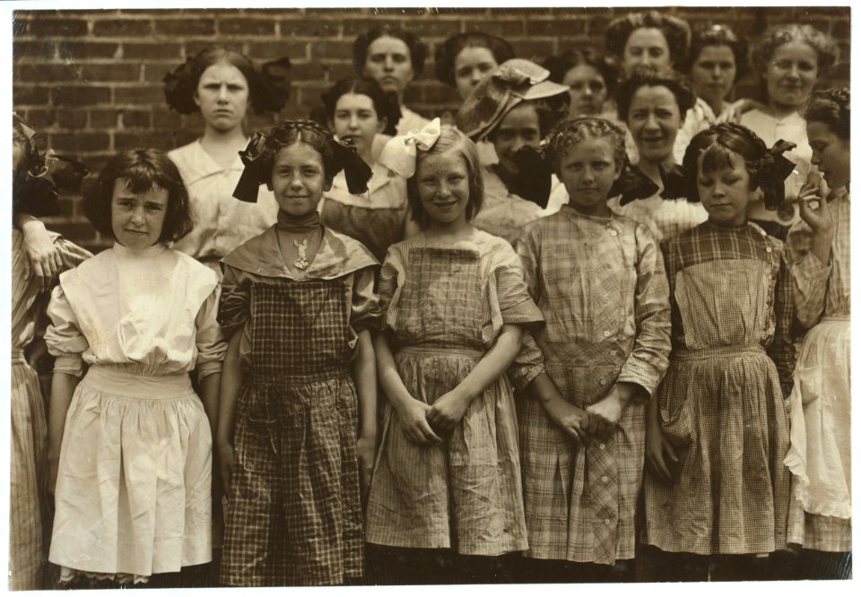 Some of the young girls who roll cigarettes in the Danville (Va.) Cigarette Factory. I could not induce the very smallest ones to get into the photos. See other photos taken at noon and in LOC nclc.04751