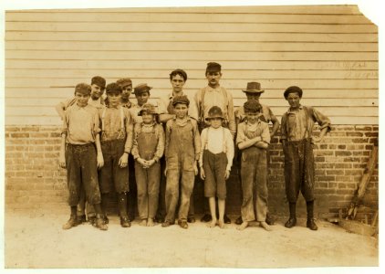 Some of the young workers in Laurel Cotton Mills, Miss. Tallest man is Mr. Hollingworth. Two of his boys in front row. Sylvester, ten years old, 'Only helps in the mill afternoons and LOC nclc.02067
