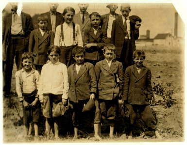 Some of the younger workers in the Beaumont Mills, Spartenberg (sic), S.C. The youngest boy on the right hand end is Bob Cook, works in spinning room -2. Said he had been working about a LOC nclc.02590 photo