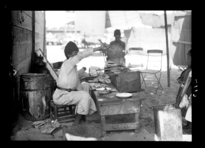 Southern Palestine. Nebi Rubin (The Prophet Reuben). A Nebi Rubin 'Cabbabji.' Broiling meat balls on spits LOC matpc.15521
