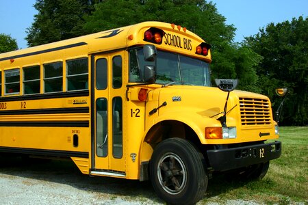 Yellow transportation schoolbus photo