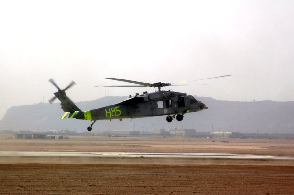 Specially equipped MH-60S Seahawk helicopter launches in support of firefighting efforts
