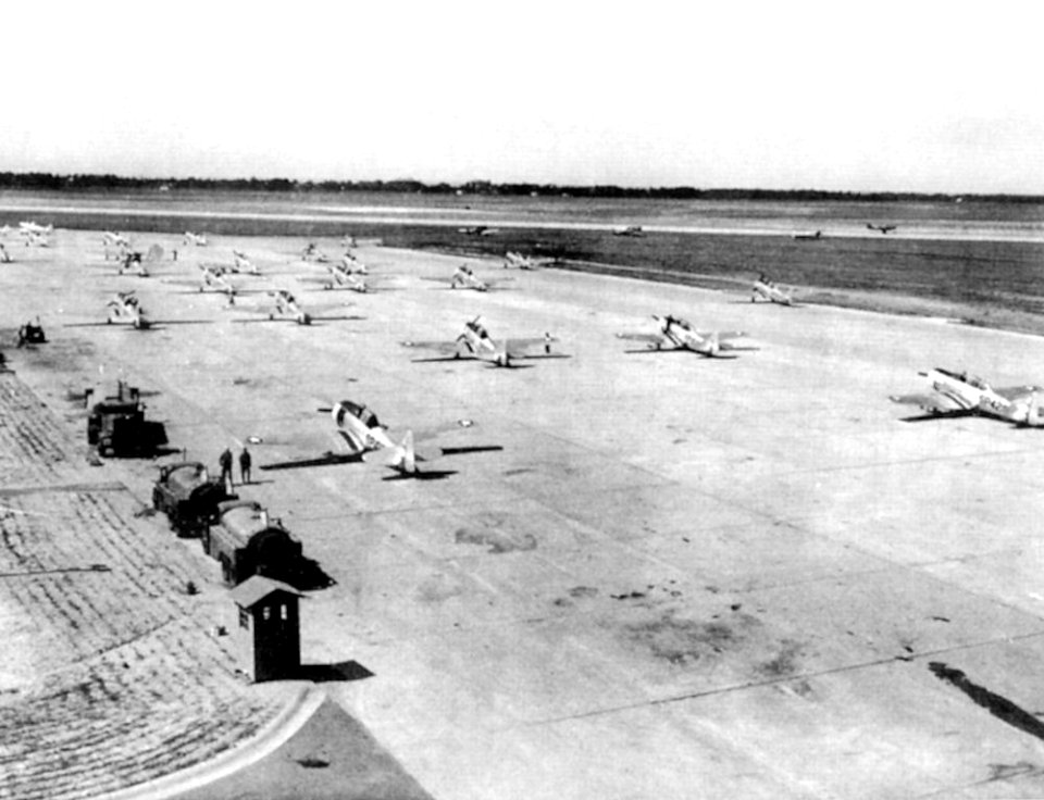 Spence Army Airfield - AT-6 Texans on Parking Ramp with Fuel Trucks