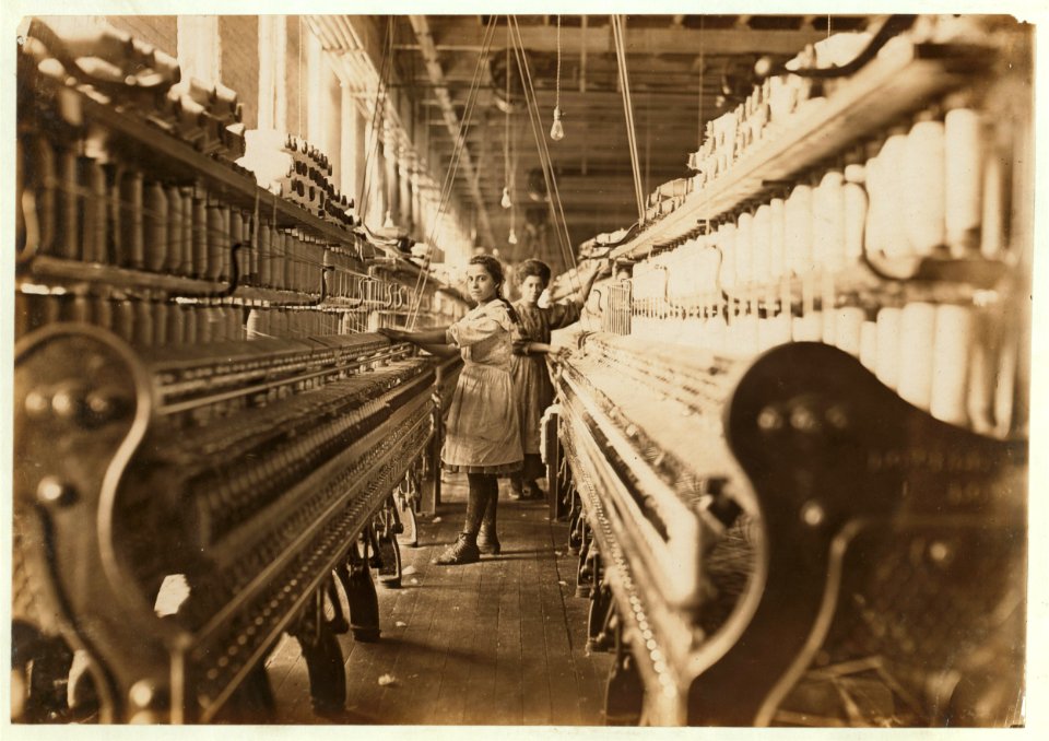 Spinner in Bibb Mil No. 1, Macon, Ga. Bad lighting and ventilation in spinning room. LOC nclc.05399