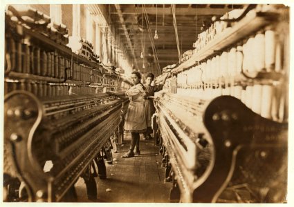 Spinner in Bibb Mil No. 1, Macon, Ga. Bad lighting and ventilation in spinning room. LOC nclc.05399