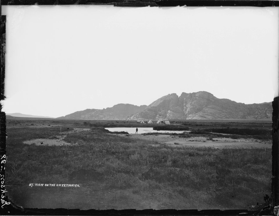 Split Mountain, another noted landmark of the Sweetwater Valley, 15 miles west of Devil's Gate, Wyoming. These... - NARA - 516898