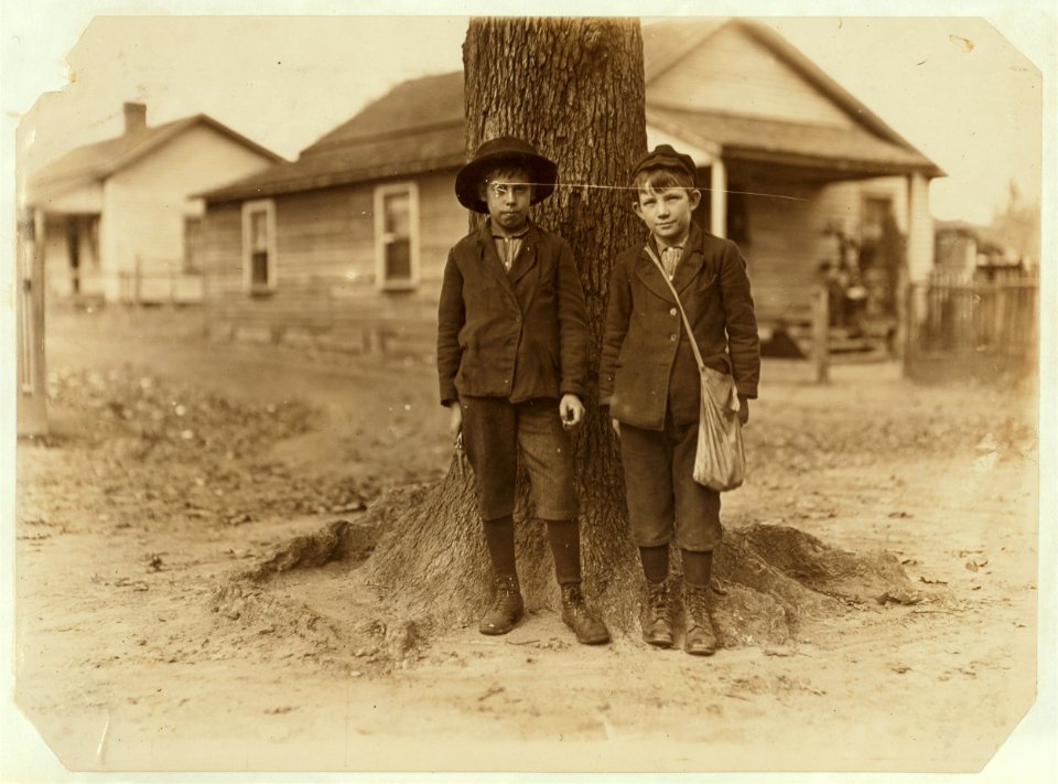 Springstein Mill, Chester, S.C. Malcolm Rogers (Boy with hat) 54 inches high. Be(e)n in mill 3 years. Started at 25 cents and now makes $1.00 a day. Spins part time and doffer part time. LOC nclc.01422