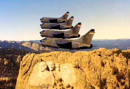 175th Tactical Fighter Squadron A-7D Corsair IIs fly past Mount Rushmore